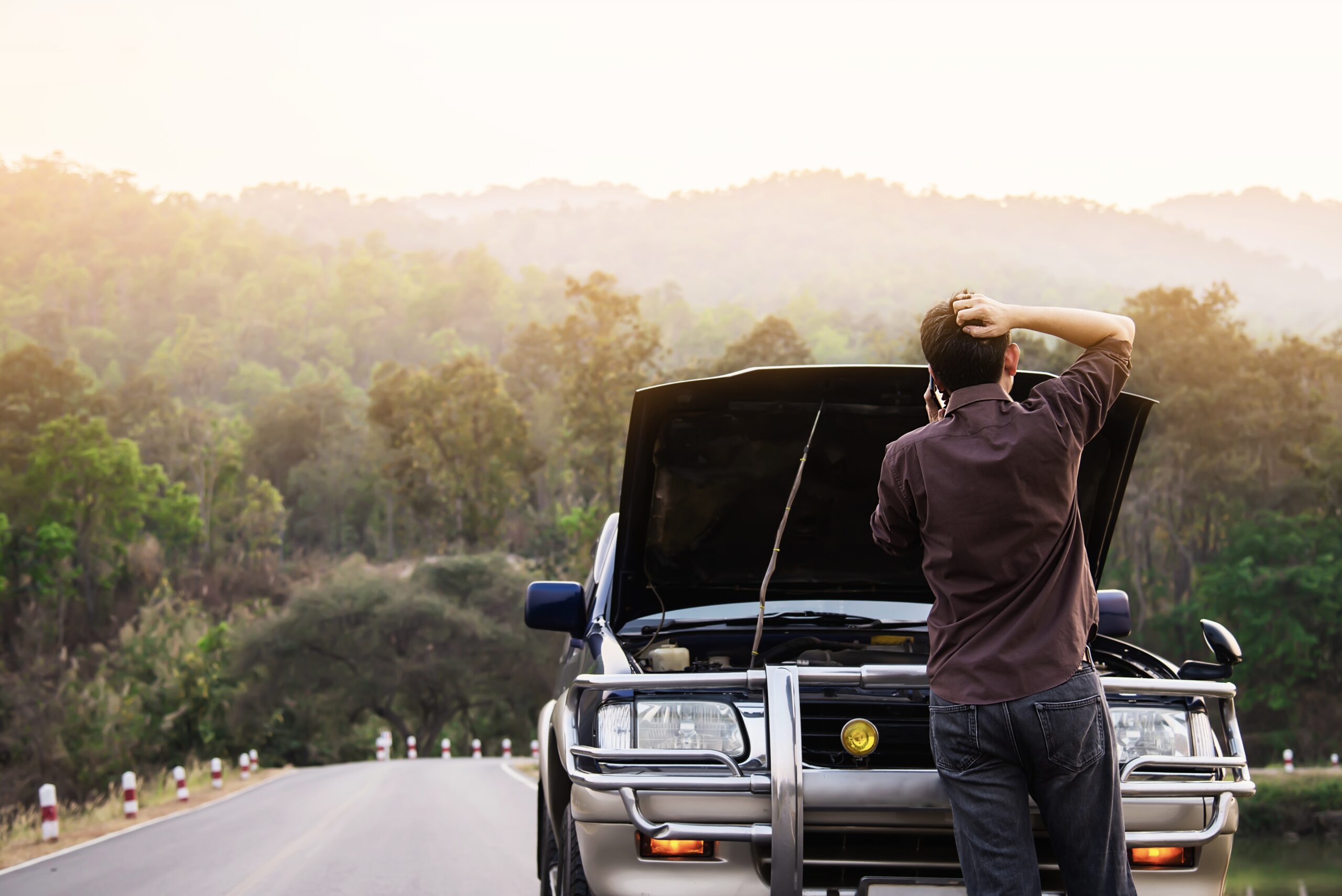 Car hood open under the sun